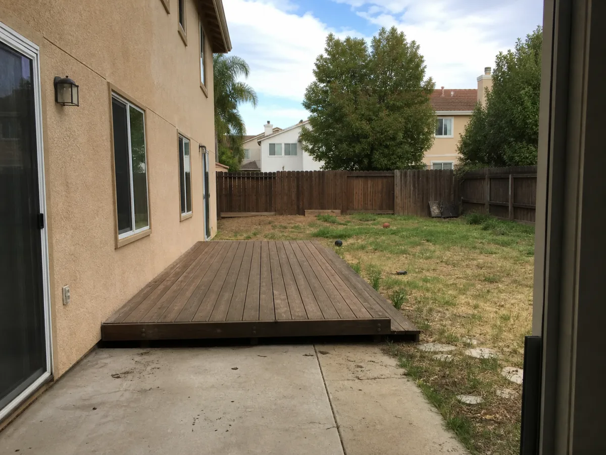 Bare, cluttered backyard before AI landscape design